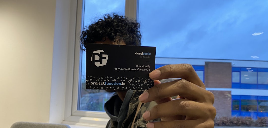 Me holding my new PF business card